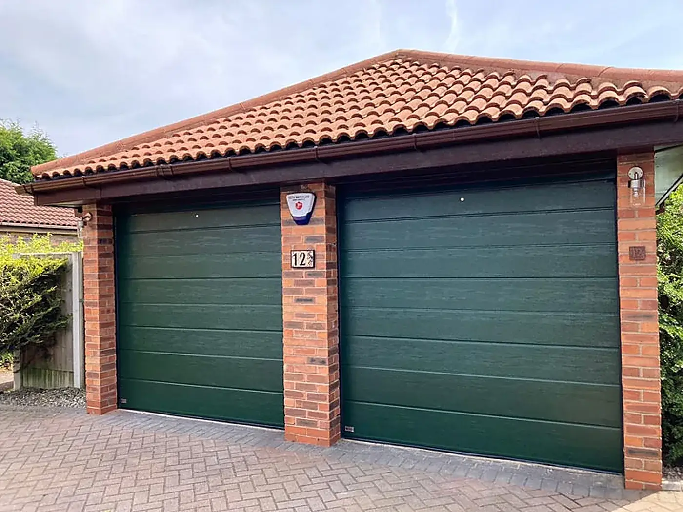 Sectional garage doors fitted to a double garage in Gauteng