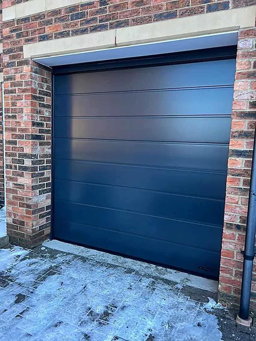 Steel sectional garage door installed on a Soweto home