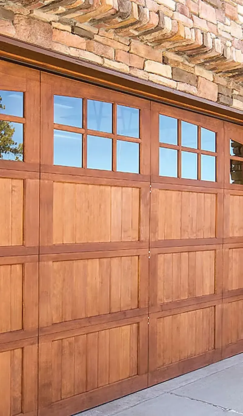 Wooden meranti garage door with glazed top panels